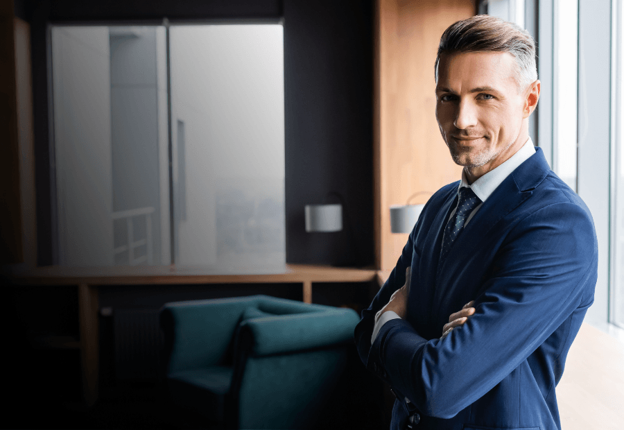 Hospitality executive reviewing performance data with Typsy reporting to monitor standards across multiple hotel properties