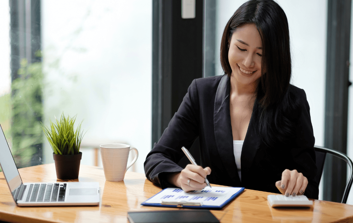 Hospitality finance leader reviewing business performance and financial reports at a desk