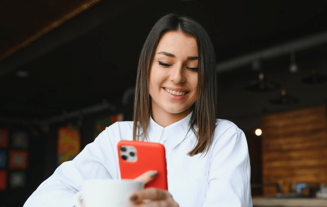 Hospitality employee accessing onboarding and learning content on a mobile phone