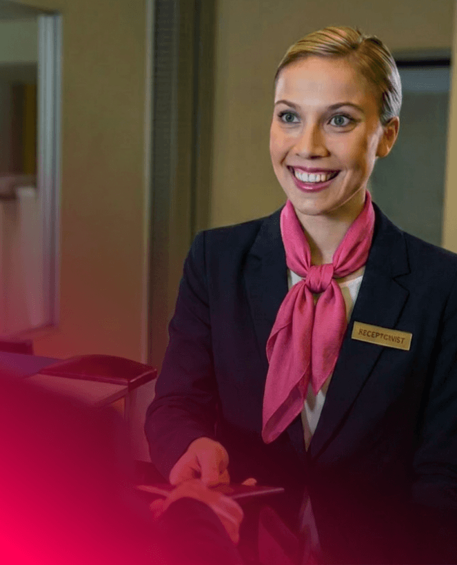 Hotel receptionist applying operational standards to deliver consistent guest service