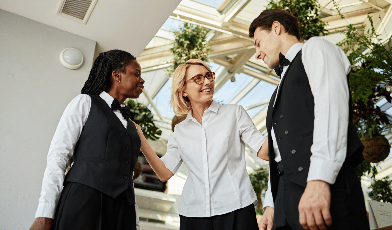 Hospitality manager coaching frontline team members to improve operational performance and guest experience